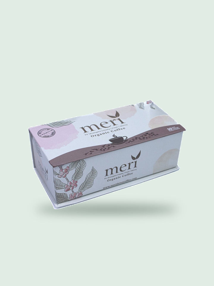 Meri Organic Coffee box with 30 day instant coffee, on a soft sage background